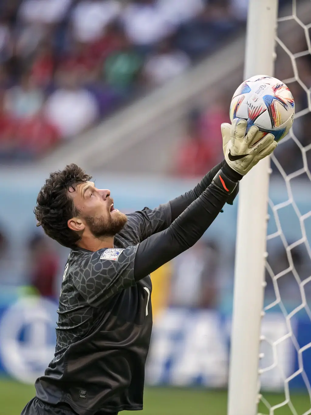 A dynamic shot of a crucial save by the goalkeeper during a Brazilian Série A match, highlighting the tension and excitement of live football.